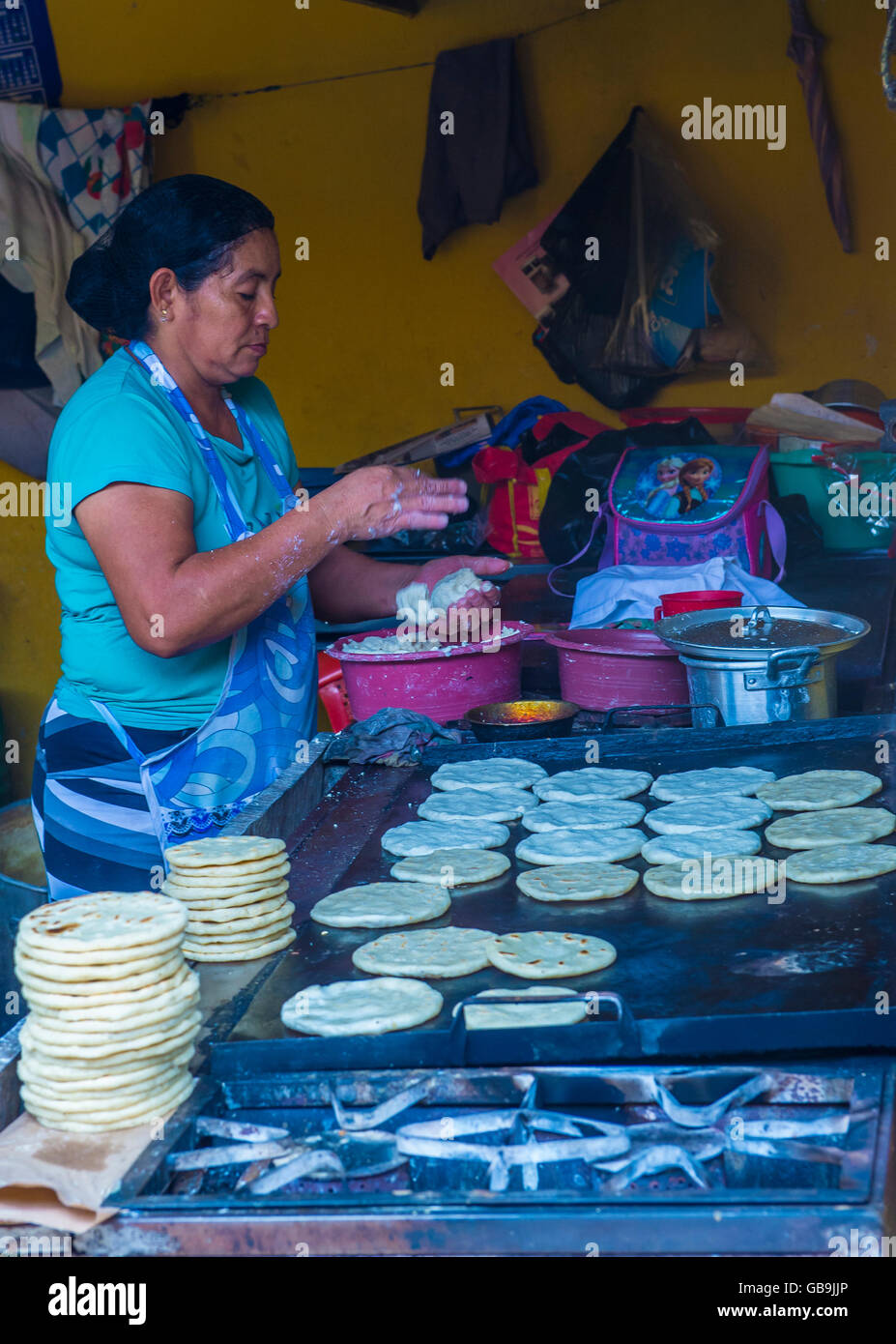 Salvadoran woman prepares Popusas in Suchitoto El Salvador Stock Photo