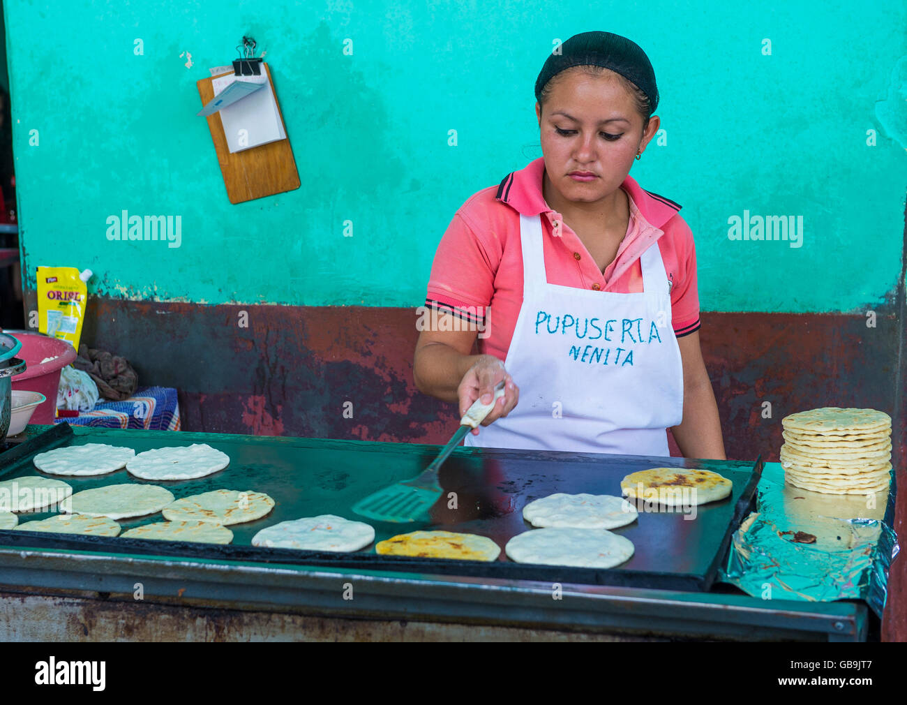 Salvadoran woman prepares Popusas in Suchitoto El Salvador Stock Photo