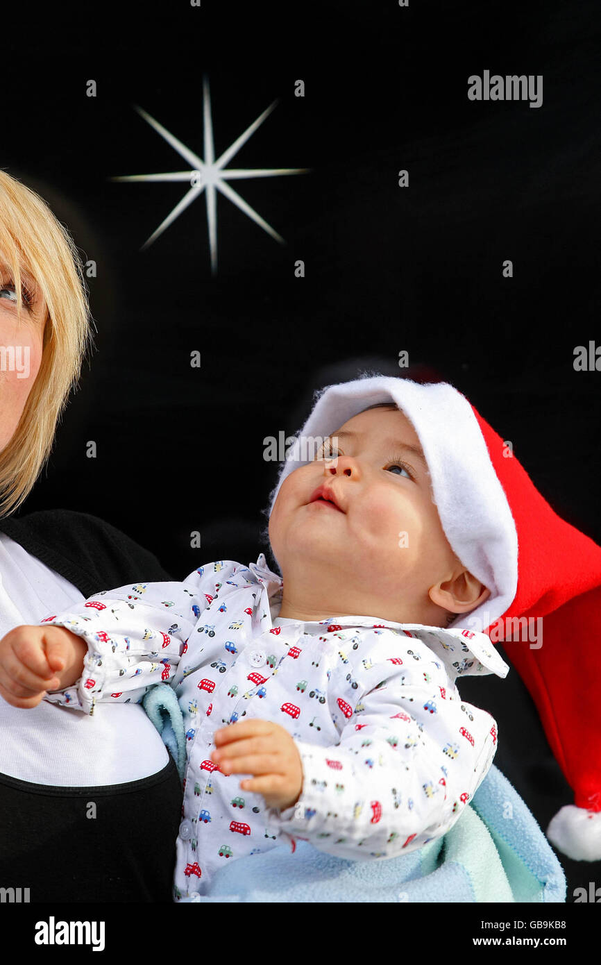 Santa abseils past Clery's Clock Stock Photo