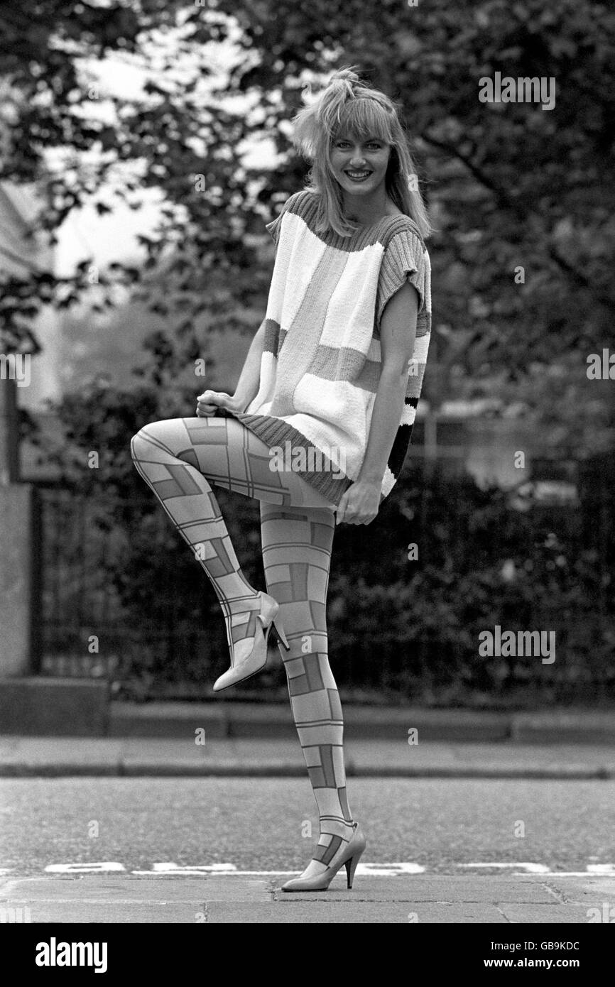 Model Maril Warne wearing 'graphique' tights, a striking multi-colour printed Mondrian-inspired pattern. She was showing off the Pretty Polly Spring 1986 Creations Collection, designed by Emilio Cavallini. Stock Photo