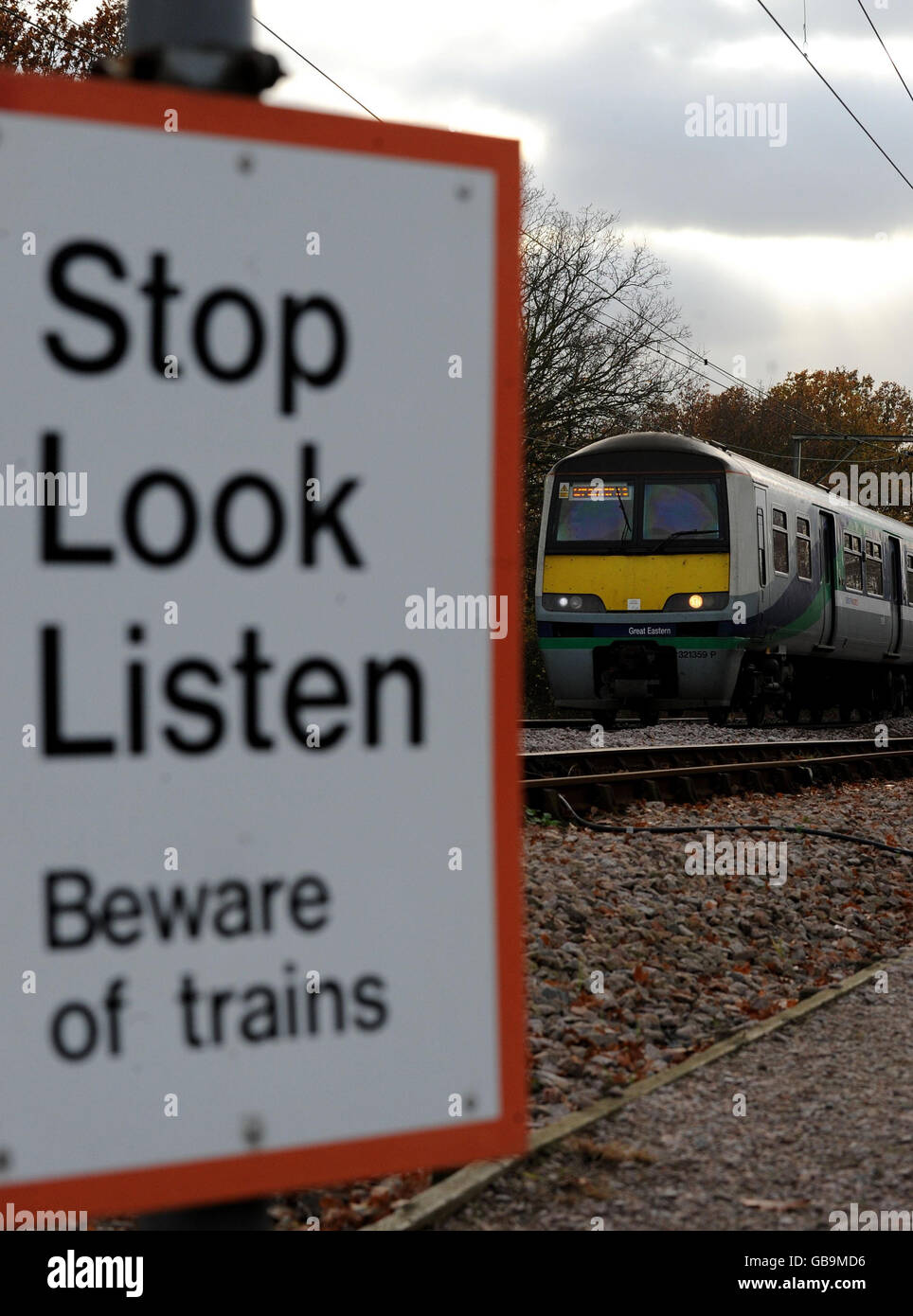 Transport Stock Rail. Transport Stock: National Express East Anglia Class 321 EMU locomotive travels through Ingatestone, Essex. Stock Photo