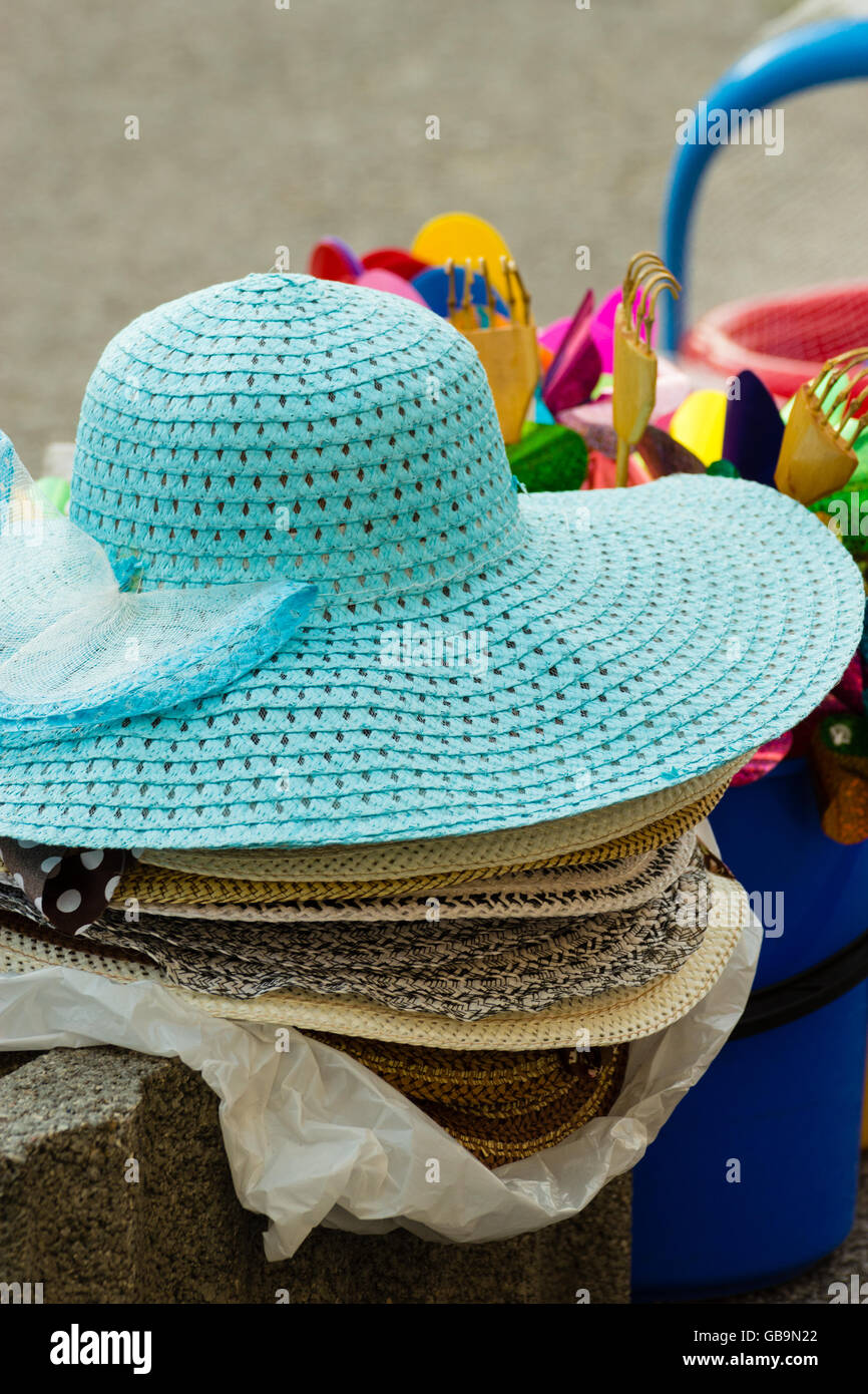 Summer hats for sale in a market stall outdoor Stock Photo Alamy