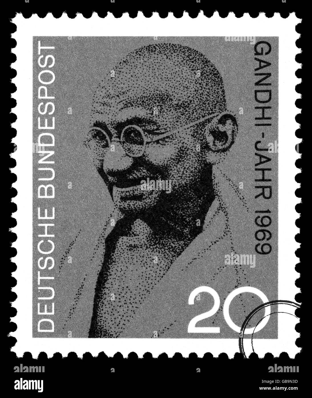 A postage stamp printed in Germany depicting a portrait of Mohandas Karamchand Gandhi, circa 2004 Stock Photo