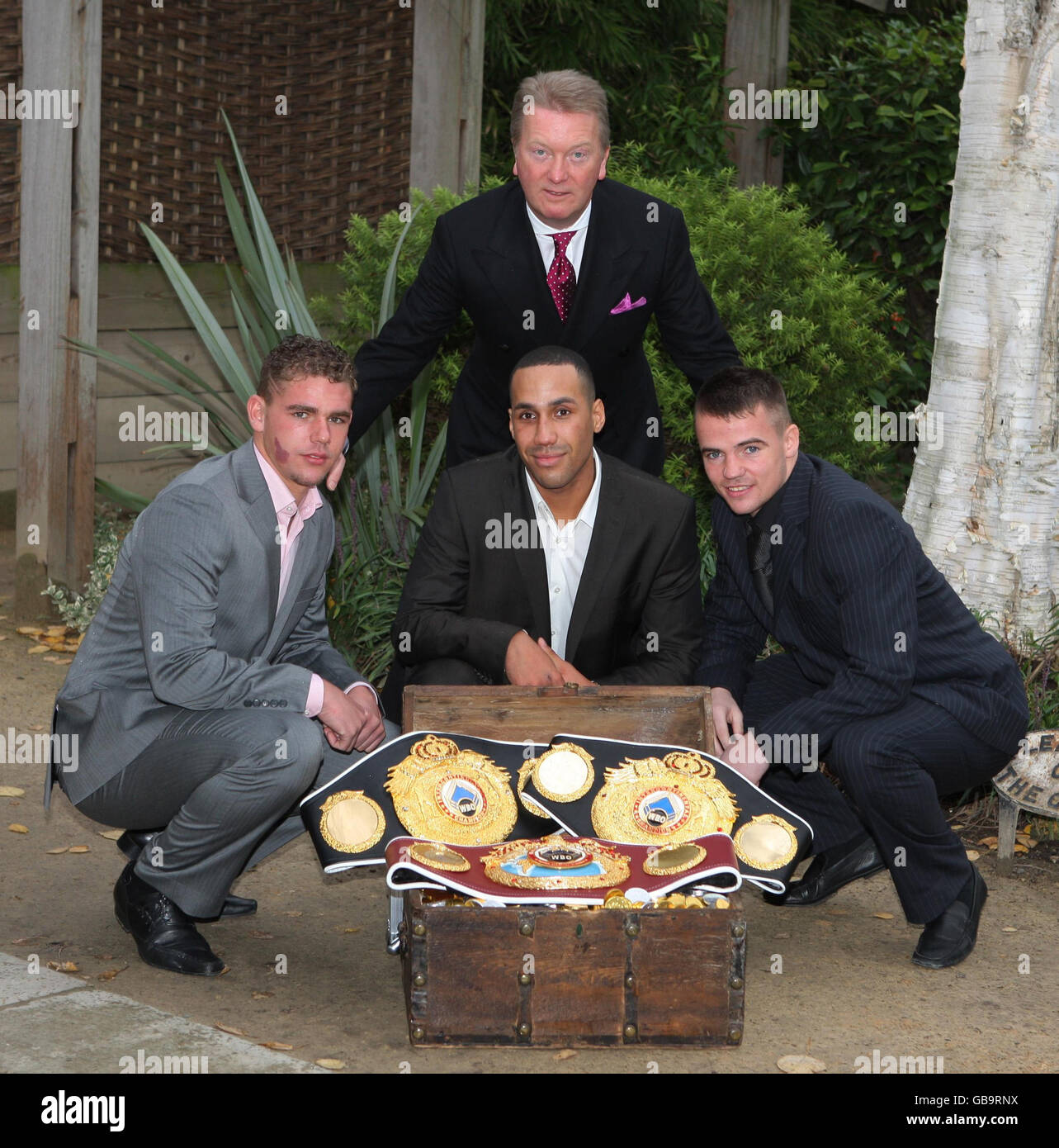 Boxing promoter Frank Warren (top) with James DeGale (centre), Billy Joe Saunders (left) and Frankie Gavin as they pose for the media at Frederick's, Islington, London. Stock Photo