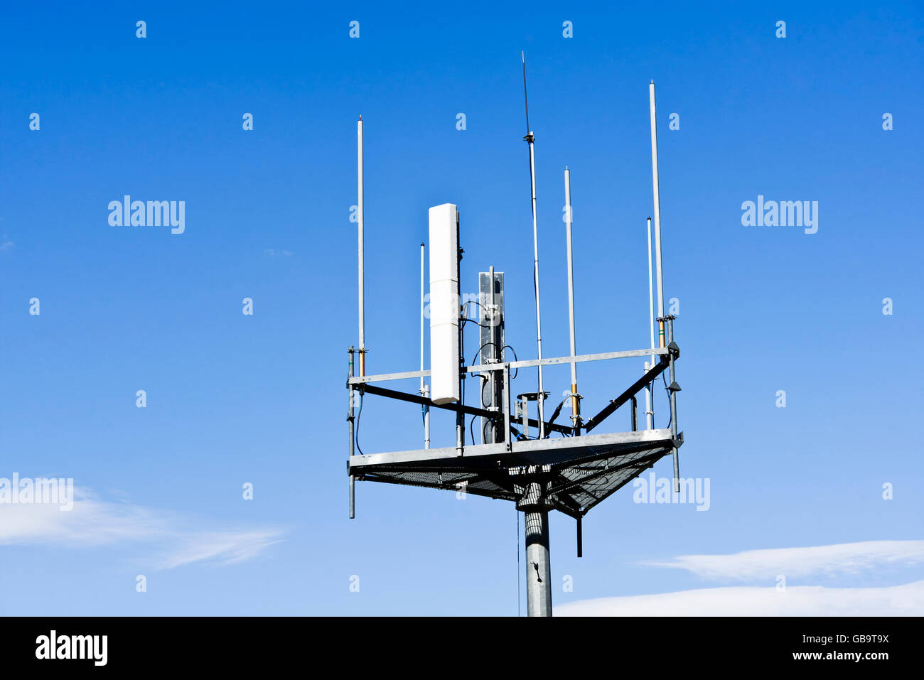 Detail of the top of a cellular mast to send and receive radio mobile communications Stock Photo