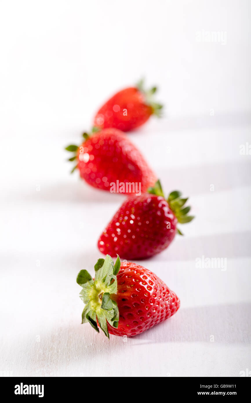 Four juicy strawberry on the table Stock Photo