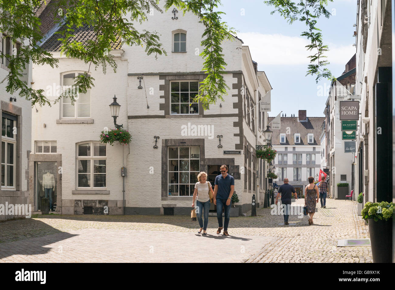 Couple walking through Maastricht old town, Holland, Europe Stock Photo