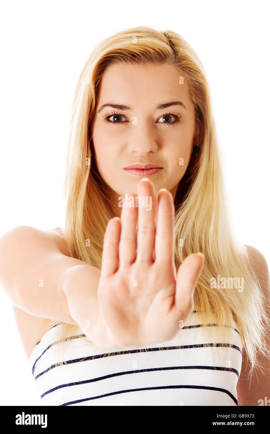 Young woman making stop sign on white background. Stock Photo