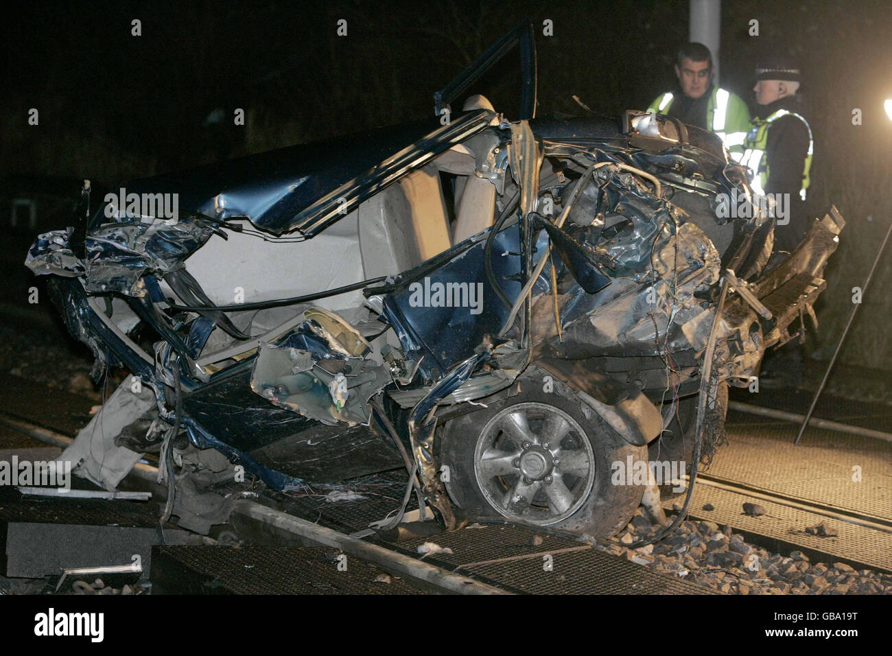Train hits empty car on track Stock Photo - Alamy