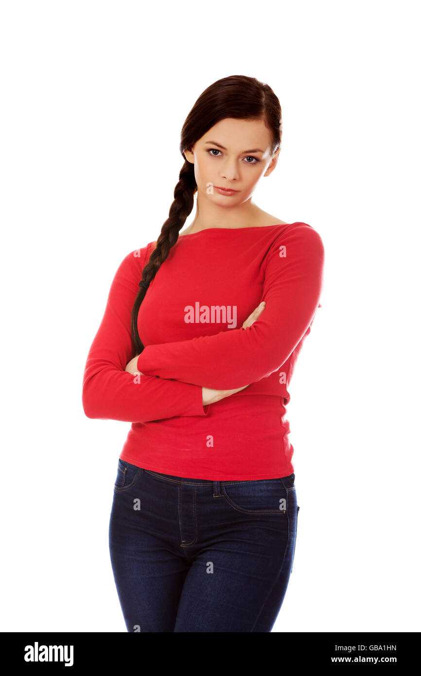 Annoyed young woman with arms crossed Stock Photo