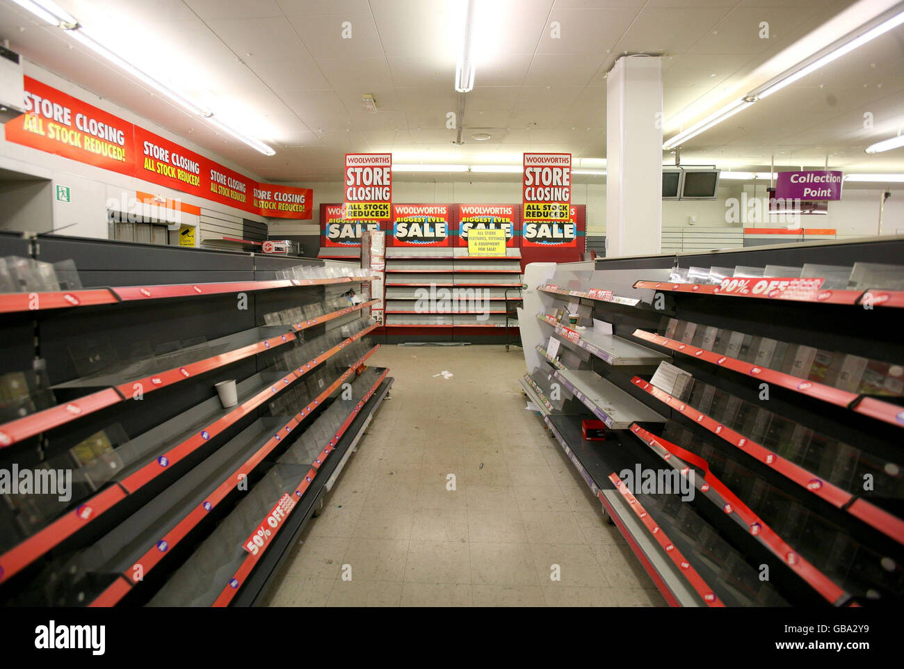 Empty shelves at the Portobello Road branch of Woolworths as the store closes its doors for the