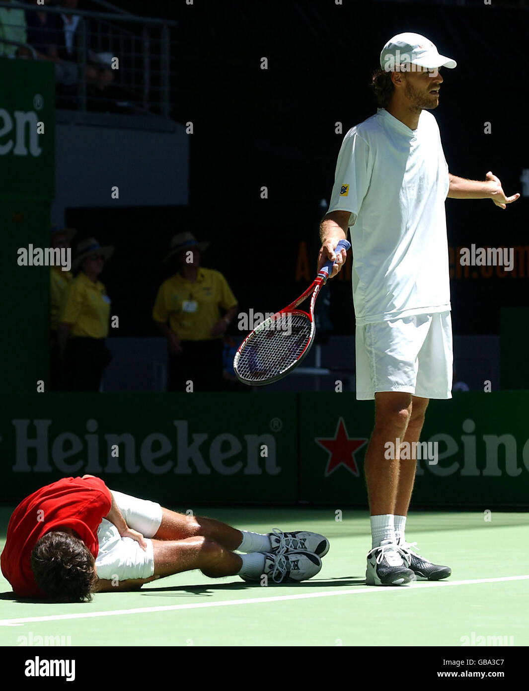 John Van Lottum of Holland collapses to the floor from cramp as Gustavo