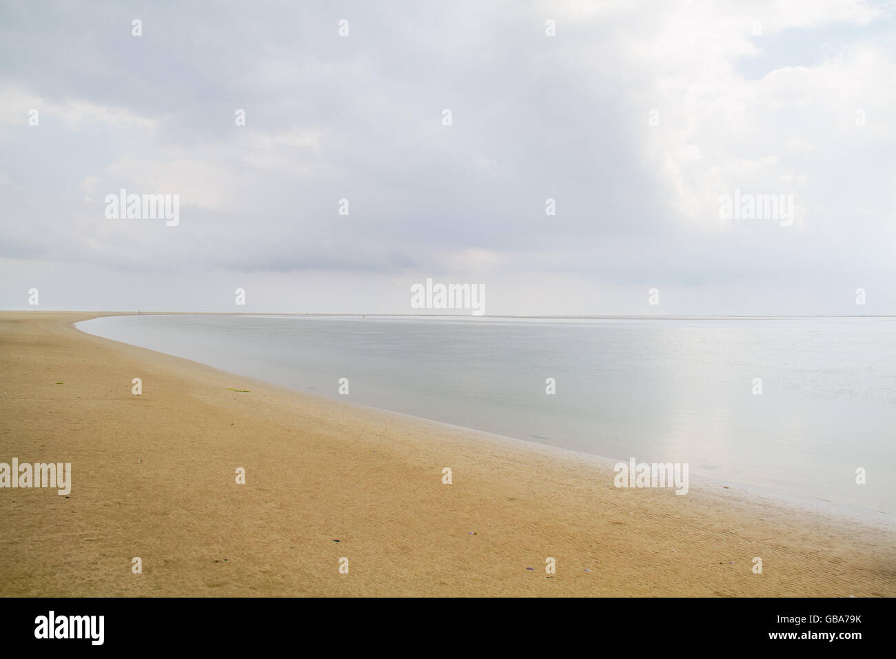 Vast, deserted beach and smooth sea, the eastern part of the Dutch island Schiermonnikoog Stock Photo