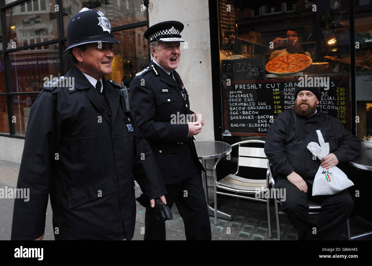 Metropolitan Police Commissioner Sir Ian Blair and with PC Andy Moss walk through the streets of Soho, London, where Sir Ian used to patrol 34 years ago. Stock Photo