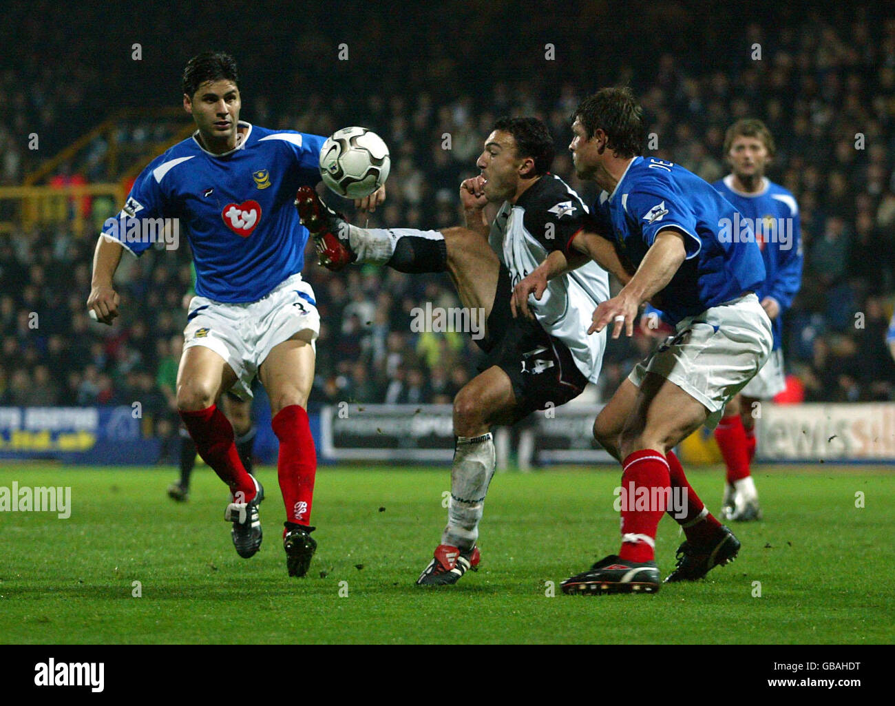 Soccer - FA Barclaycard Premiership - Fulham v Portsmouth. Fulham's Steed Malbranque (c) gets in between Portsmouth's Dejan Stefanovic (l) and Arjan De Zeeuw (r) Stock Photo