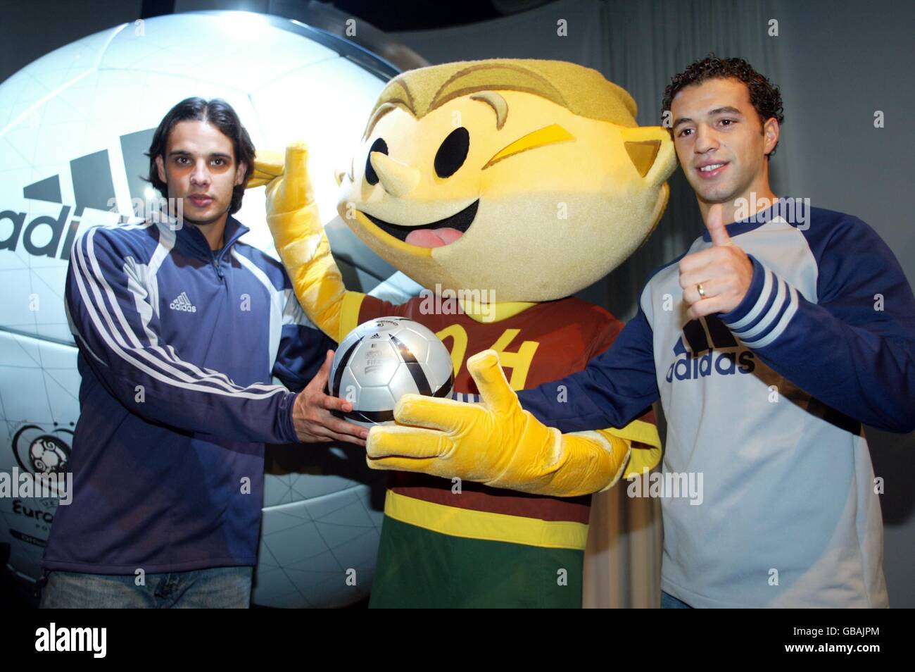 The Portugal mascot for the Euro 2004 Championships Kinas with players Nuno  Gomes and Simao Sabrosa and the new Adidas matchball Stock Photo - Alamy