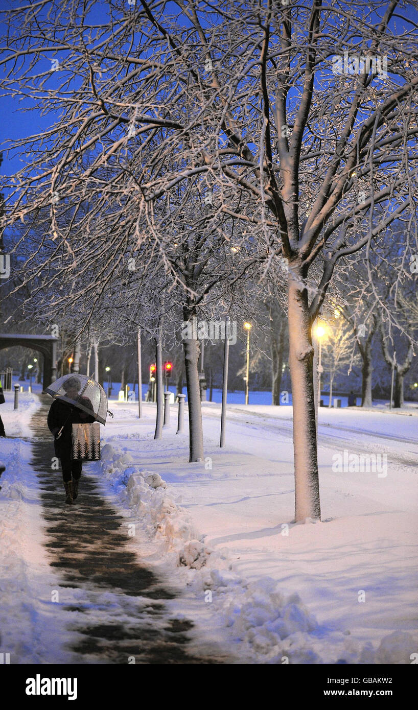 A person makes their way to work in Harrogate through snow this morning. Stock Photo