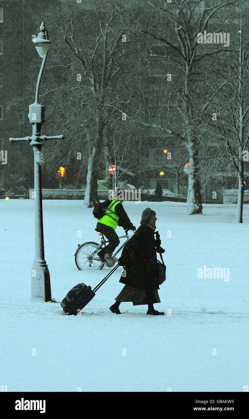People make their way to work in Harrogate through snow this morning. Stock Photo