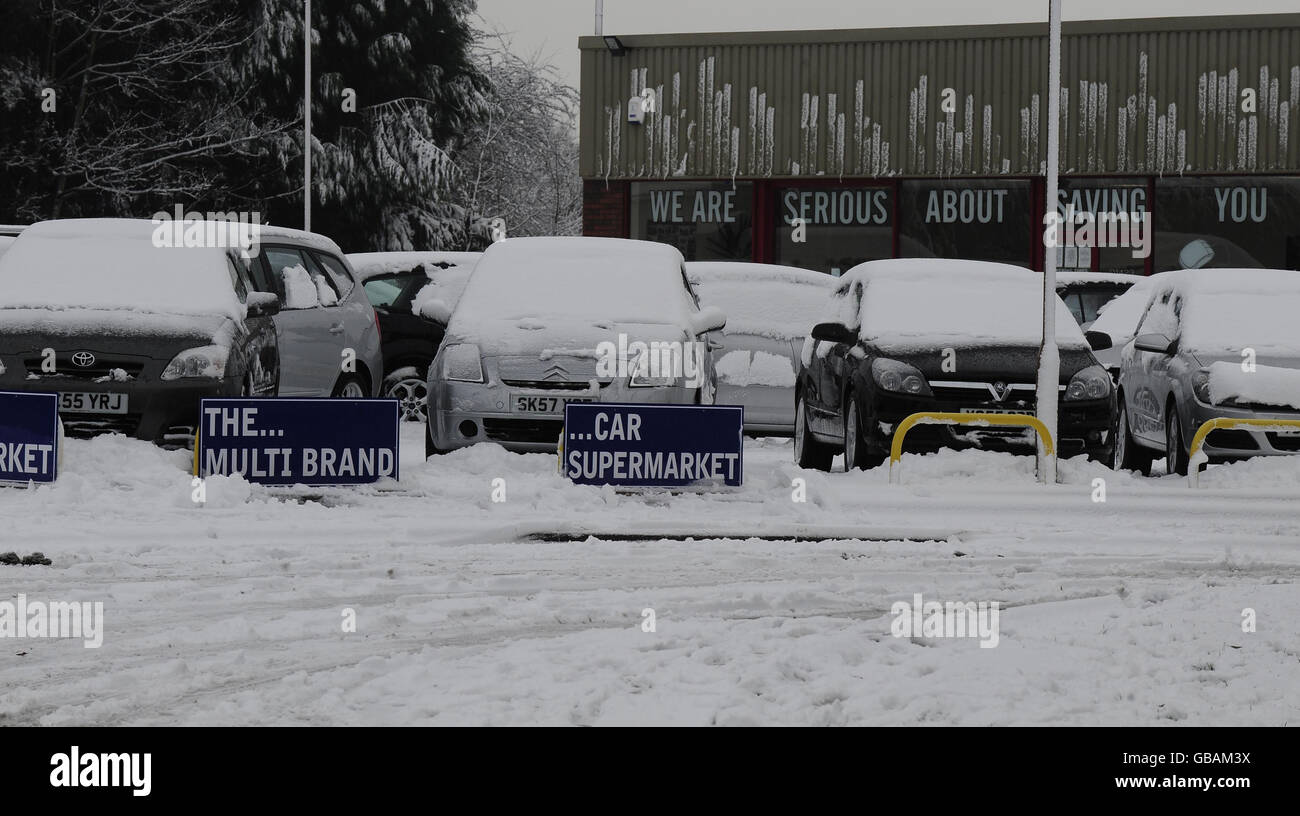 Advertisements offer cars at low prices at a car dealership in Harrogate. Stock Photo
