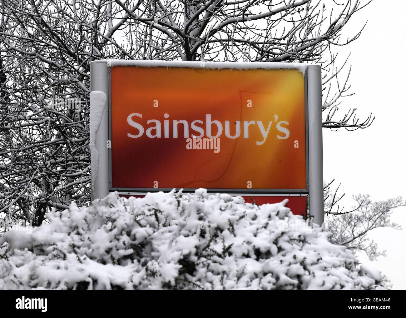 A snow-covered sign at the Sainsbury's superstore in Harrogate. Stock Photo