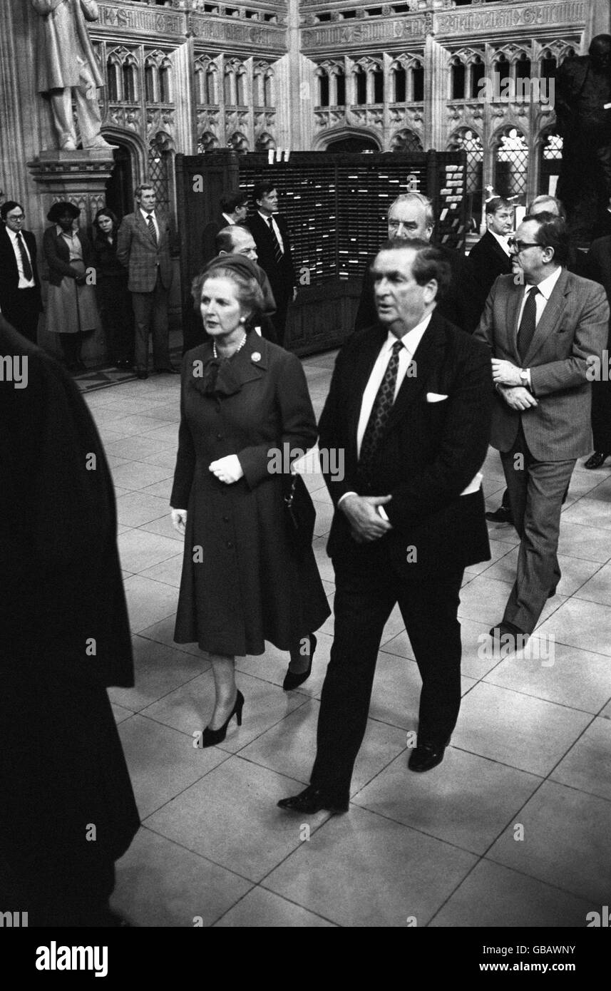 Prime Minister Margaret Thatcher, accompanied by Denis Healey, deputising for injured opposition leader Michael Foot, en route to the House of Lords after Black Rod had summoned the Commons to the Lords. Stock Photo