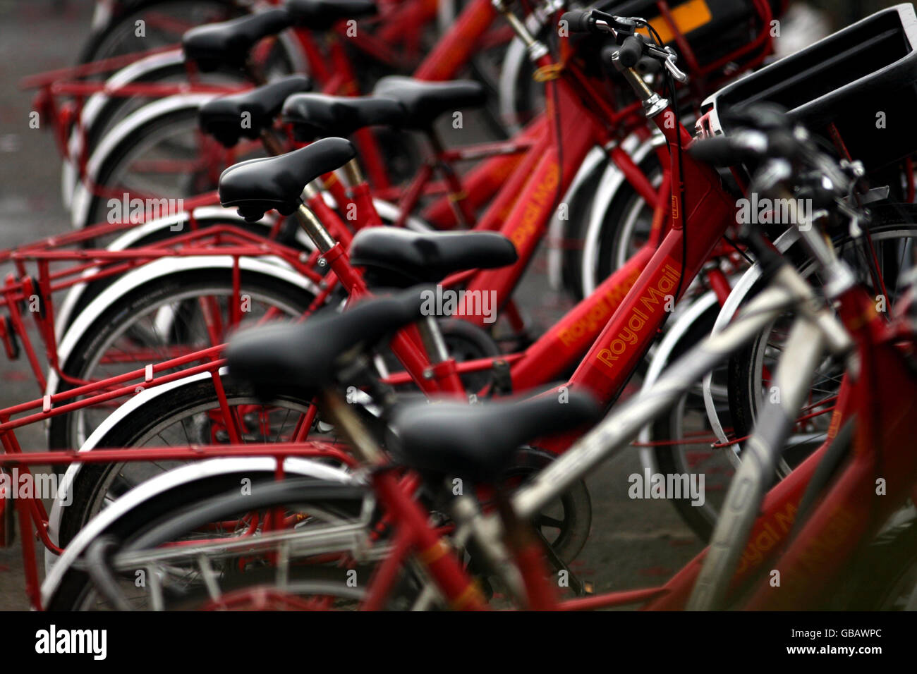 Royal Mail cycles lined up outside the York sorting office in the town centre. Stock Photo