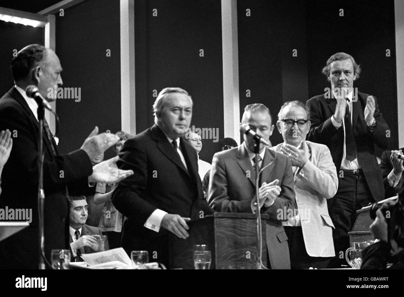 Standing ovation for Harold Wilson after his speech attacking the Prime Minister and giving his own policy to fight inflation. Left to right: Tom Driberg, Harold Wilson, Ron Hayward, Sir Harry Nicholas, and Tony Benn. Stock Photo