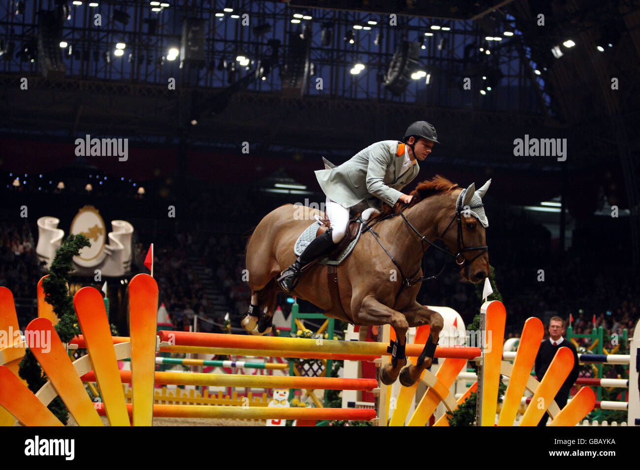 Marco Kutscher from Germany riding Available Levantos competes in the KBIS Christmas Pudding Speed Stakes on the third day of Olympia The London International Horse Show being held at the Olympia Exhibition Centre in West London. Stock Photo