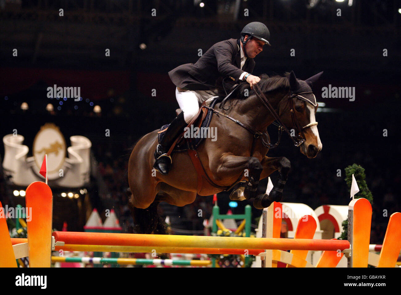 Philippe Le Jeune from Belgium riding Leo du Prairial competes in the KBIS Christmas Pudding Speed Stakes on the third day of Olympia The London International Horse Show being held at the Olympia Exhibition Centre in West London. Stock Photo