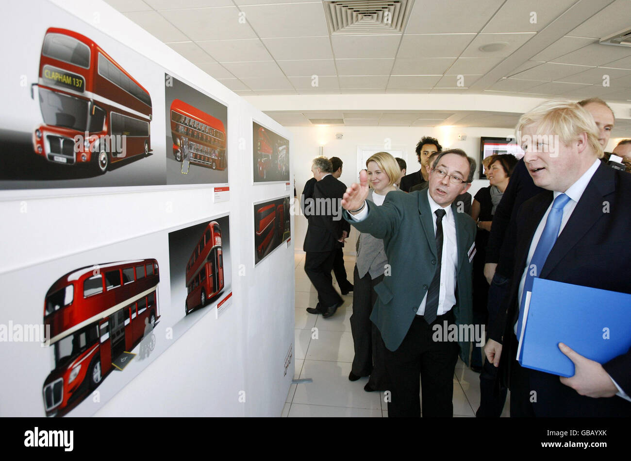 London Mayor Boris Johnson is shown the two winning designs in the New Bus for London competition at a reception inside Millbank Tower, central London, with the Capoco Design Ltd image pictured top left, and the collaborative design from Aston Martin and Foster and Partners pictured top right. Stock Photo
