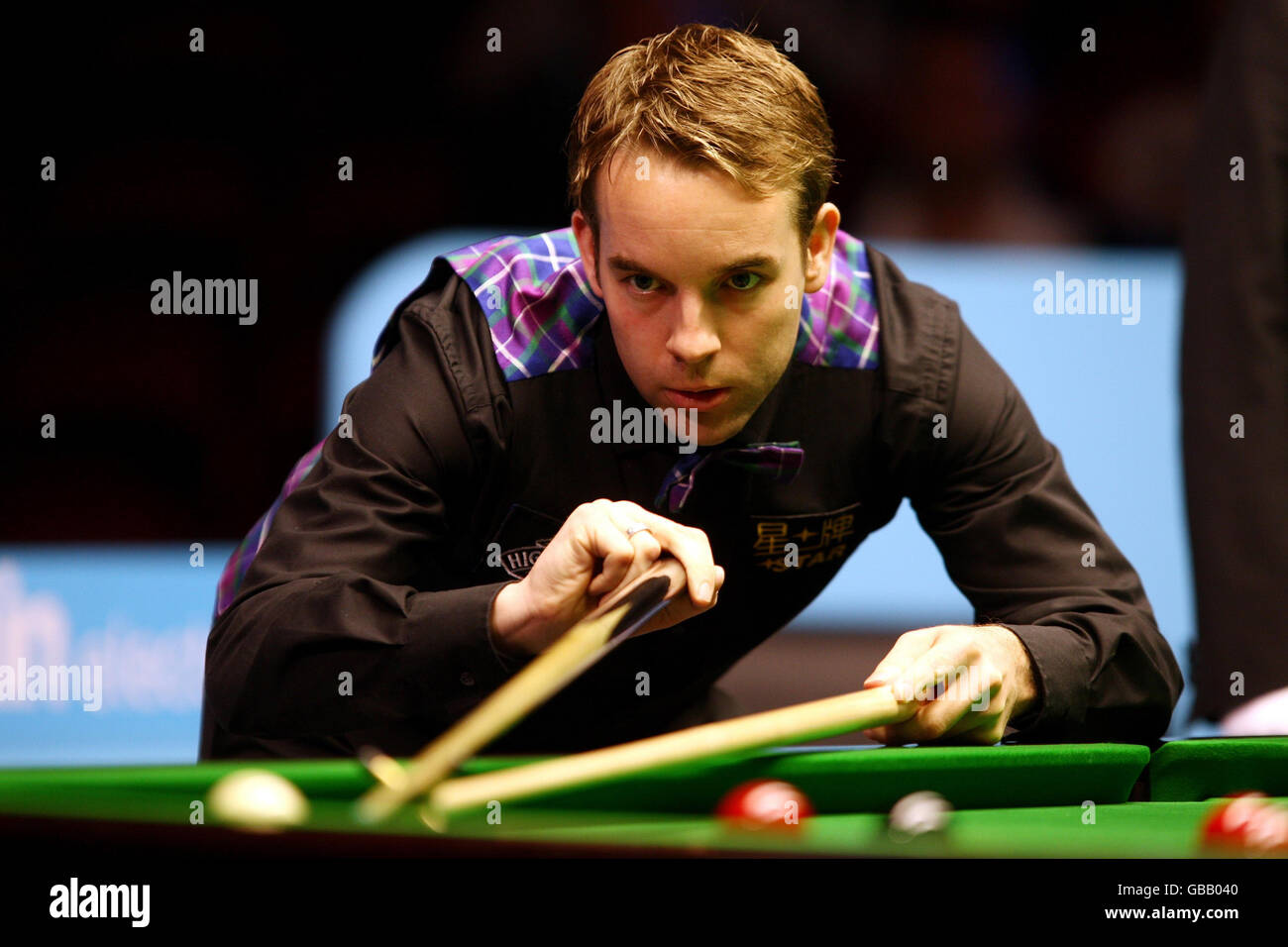 Allister Carter in action against Marco Fu during the semi final match in the Maplin UK Championship at The International Centre, Telford. Stock Photo