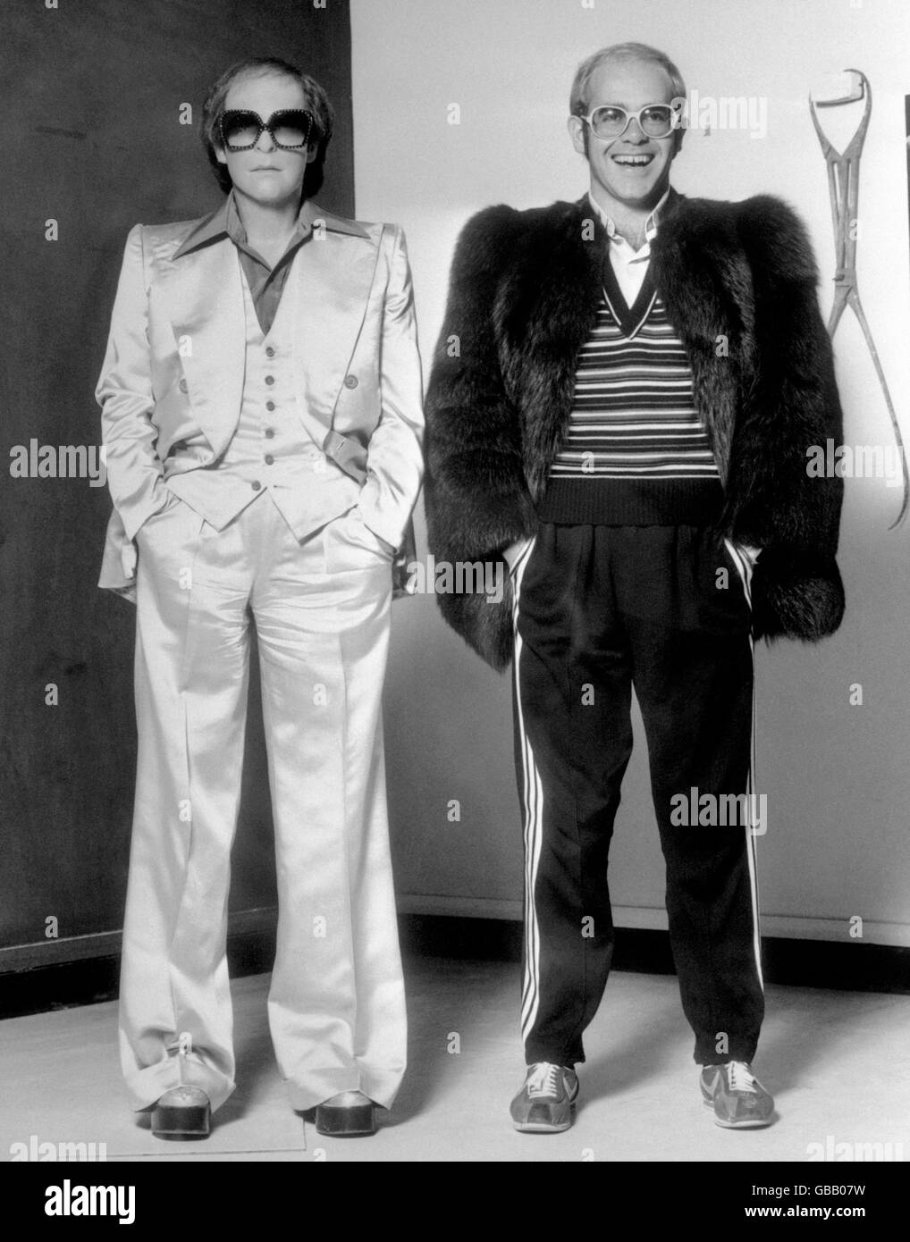 Super pop star Elton John (right) with his wax portrait in Madame Tussaud's studio. The figure joined a new version of Heroes - a space where figures appear out of the dark in a sequence of light, sound and projection. Stock Photo