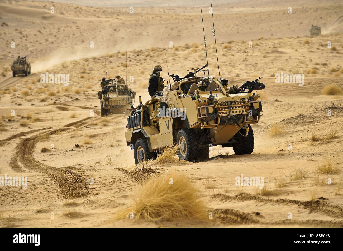 British Army Jackals on patrol through the Eastern Desert in Helmand Province, Afghanistan. Stock Photo