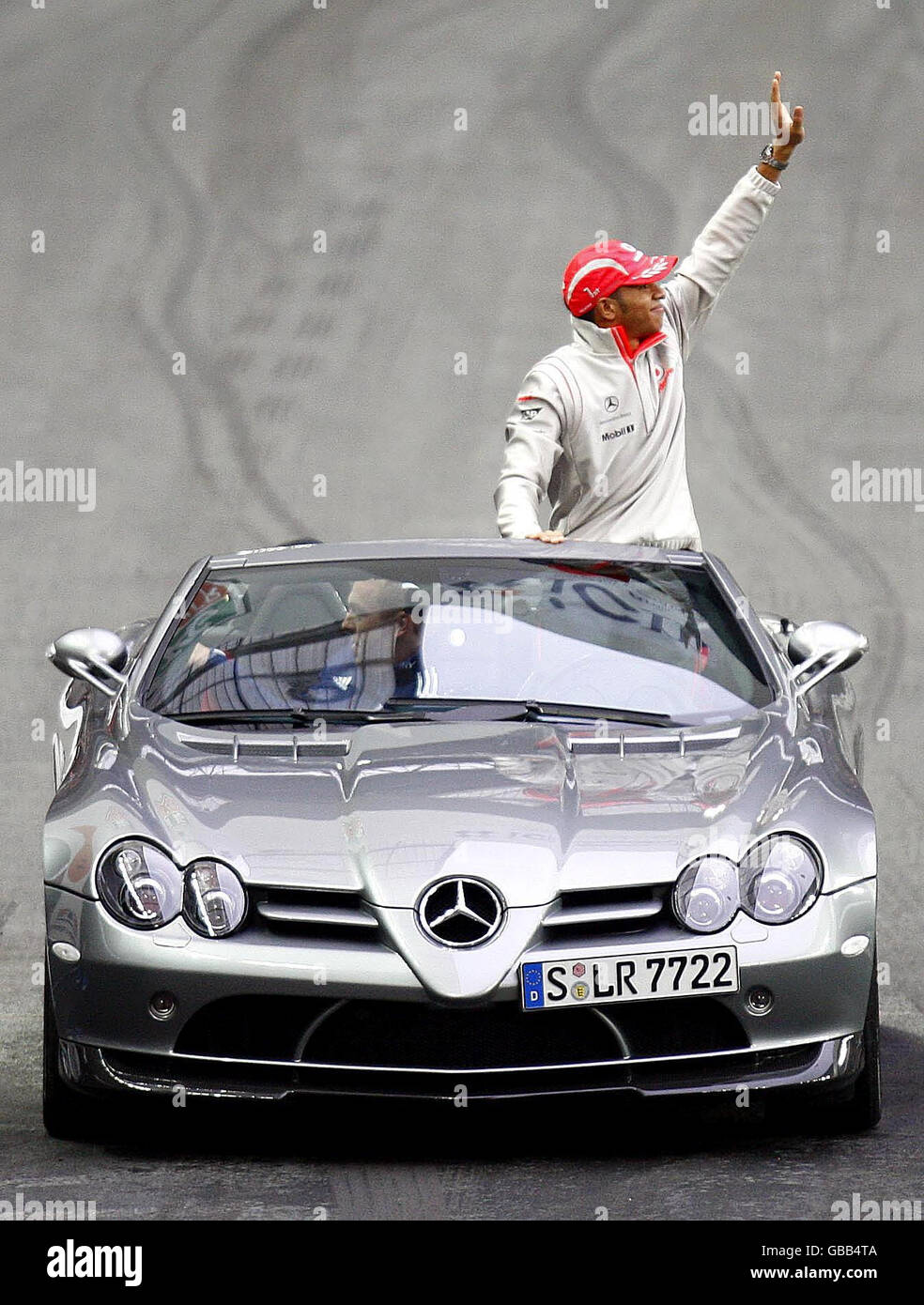 Lewis Hamilton drives Olympic cycling champion Chris Hoy round the