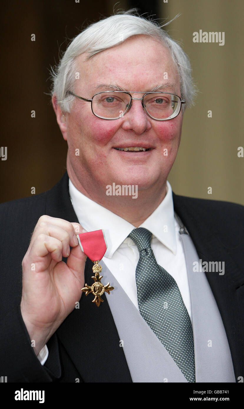 Robin Burgess, from Carlisle, with his OBE awarded for services to the newspaper industry and to the community in Cumbria, which he received from Prince Charles inside the Ballroom at Buckingham Palace in central London. Stock Photo