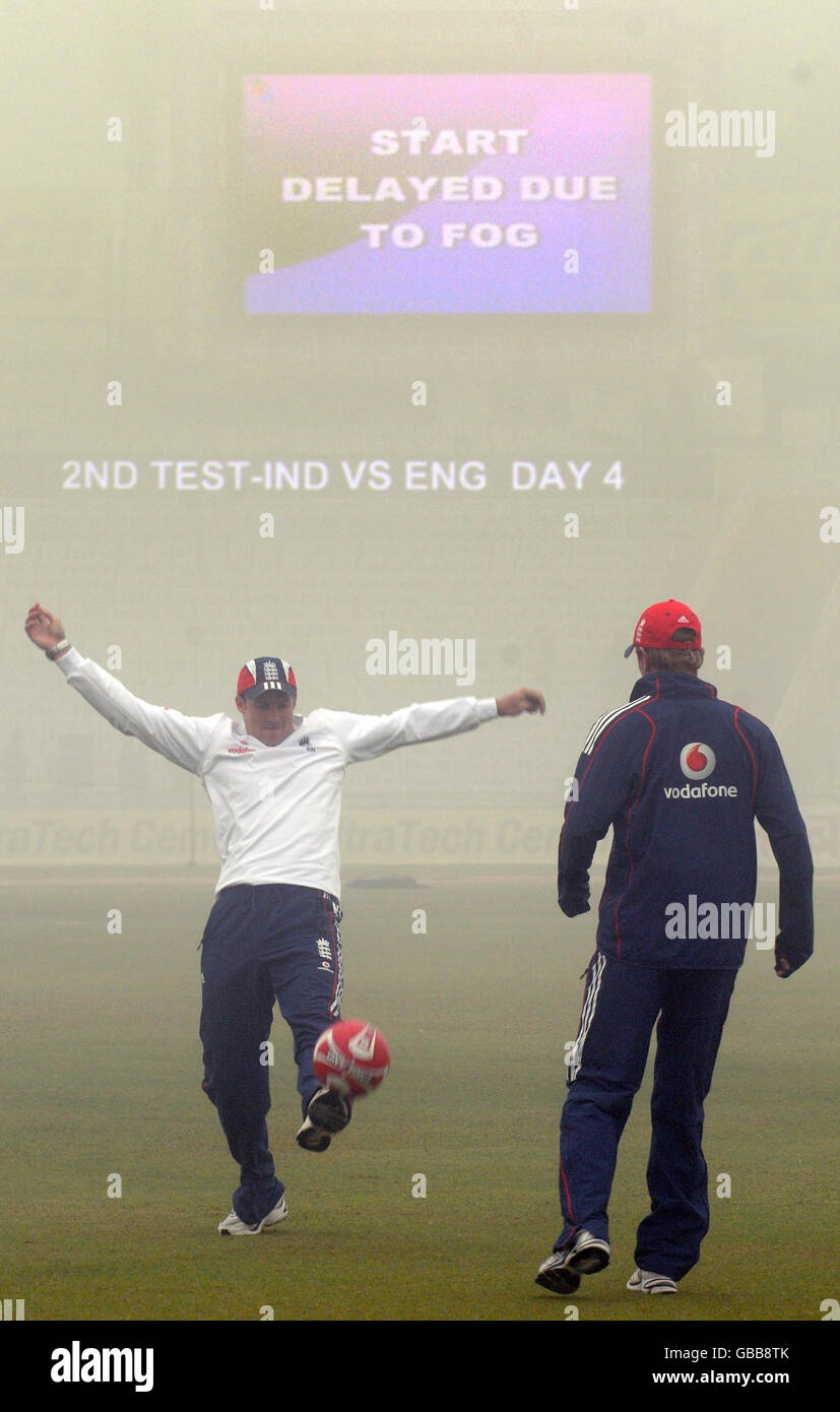 England's Andrew Strauss and Paul Collingwood play football as fog delays the start of play before during the fourth day of the second test at the Punjab Cricket Association Stadium, Mohali, India. Stock Photo