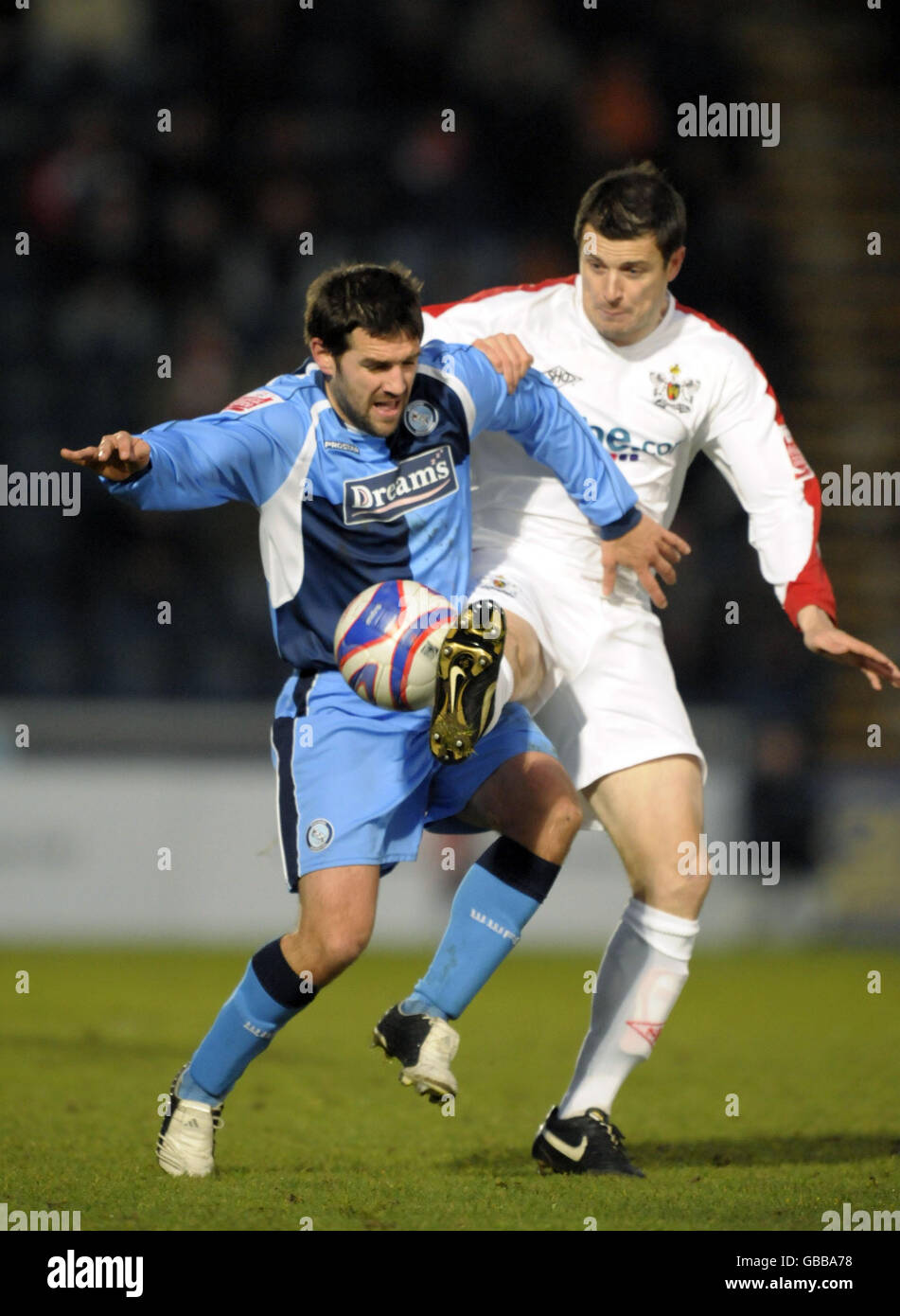 Wycombe's Tommy Doherty and Exeter's Rob Edwards battle for the ball during the Coca-Cola League Two match at Adams Park, High Wycombe. Stock Photo
