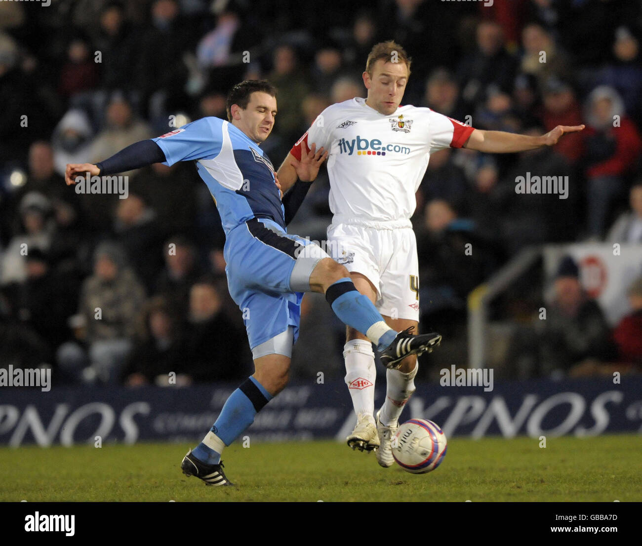 Wycombe's David McCracken and Exeter's Matt Gill battle for the ball during the Coca-Cola League Two match at Adams Park, High Wycombe. Stock Photo