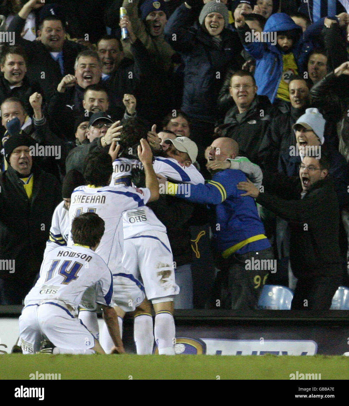 Leeds United's Robert Snodgrass is mobbed by fans and players after equalising during the Coca-Cola League One match at Elland Road, Leeds. Stock Photo