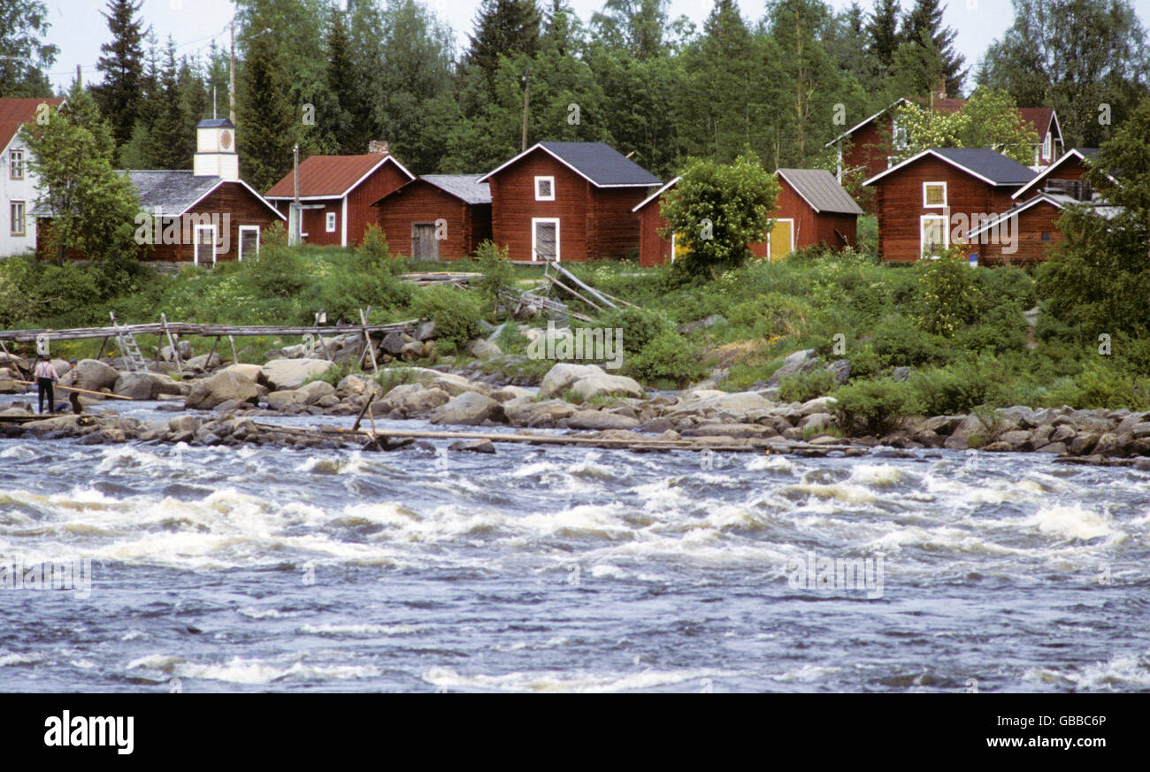 Kukkolaforsen church and cottages by the river Stock Photo