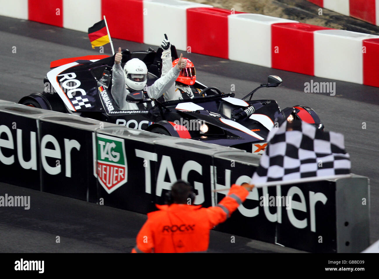 Michael Schumacher crosses the line to win a race during the Race