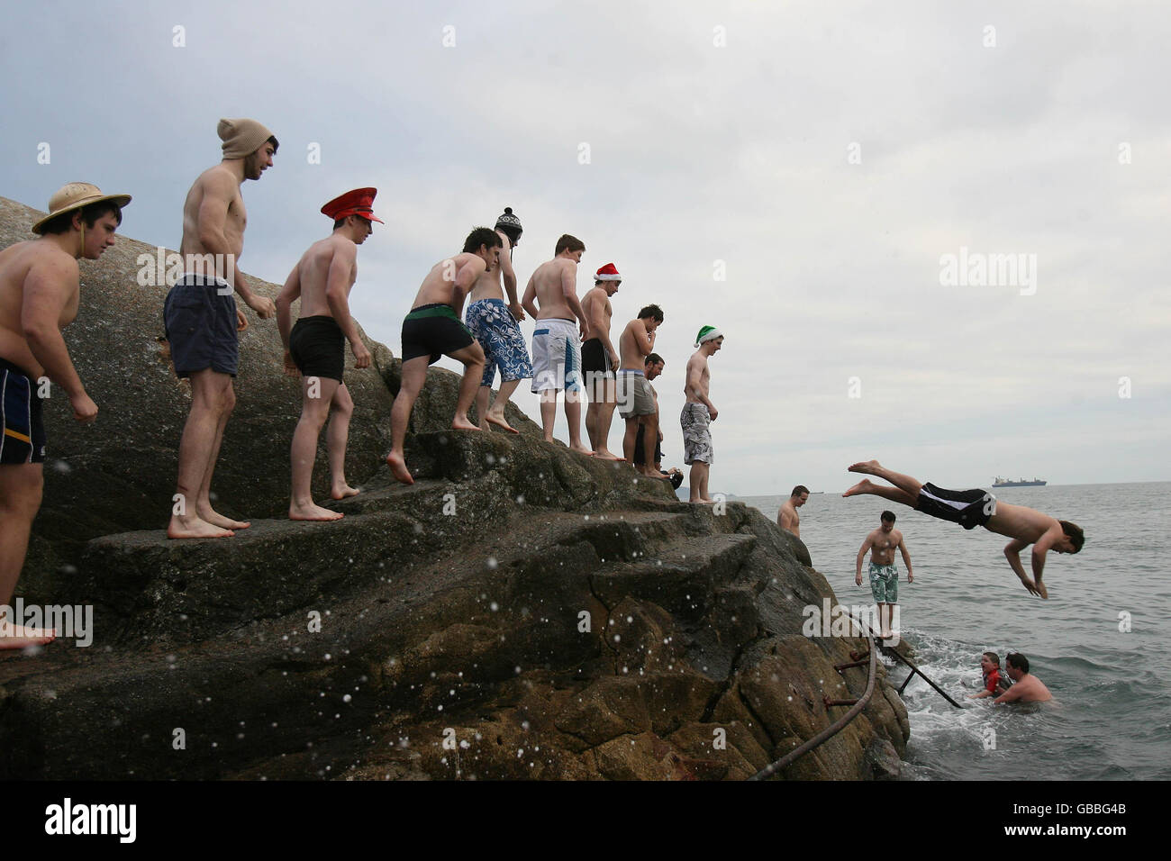 Swimmers leap into the sea at Forty Foot during the annual Christmas