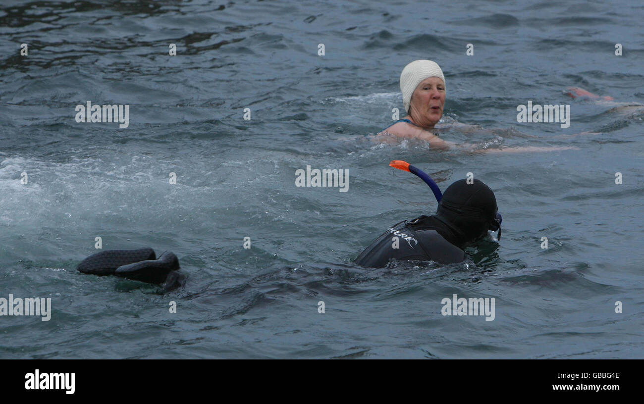 Christmas day swim Ireland. Swimmers in the sea at Forty Foot during