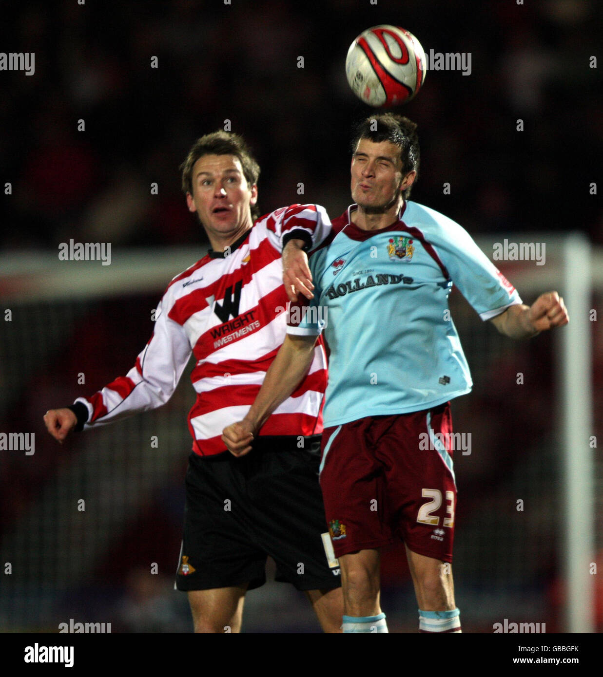 Doncaster Rovers' Gareth Taylor and Burnley's Stephen Jordan battle for the ball during the Coca-Cola Championship match at Keepmoat Stadium, Doncaster. Stock Photo