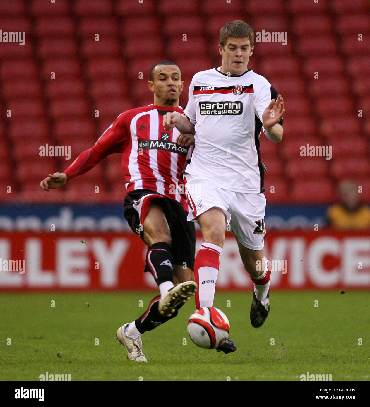 Sheffield United's Danny Webber and Charlton Athletic's Martin Cranie during the Coca-Cola Championship match at Bramall Lane, Sheffield. Stock Photo