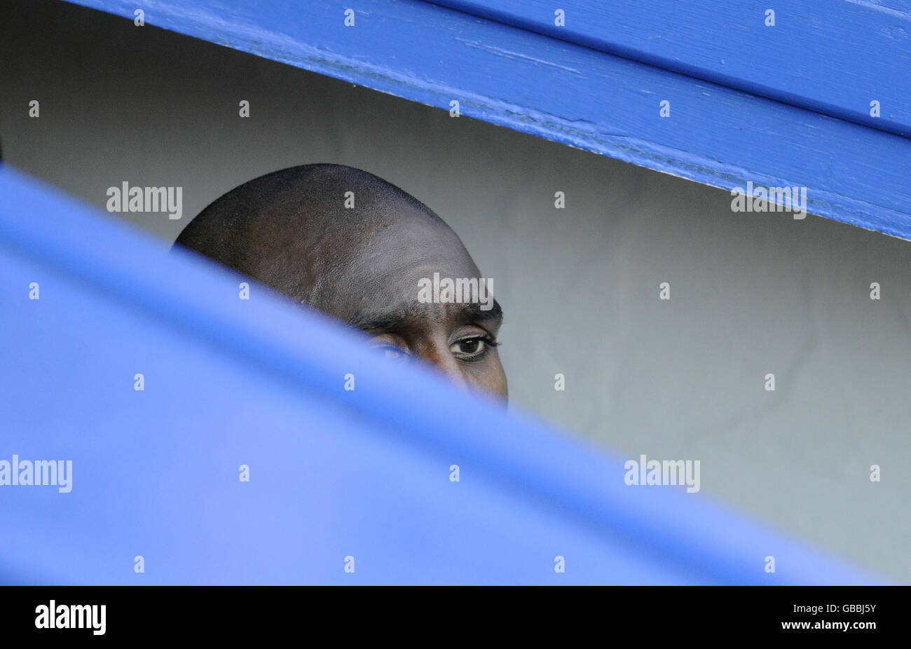 Portsmouth captain Sol Campbell is just visible in the tunnel as he waits to come on to the pitch at the start of the game prior to the FA Cup Third Round match at Fratton Park, Portsmouth. Stock Photo