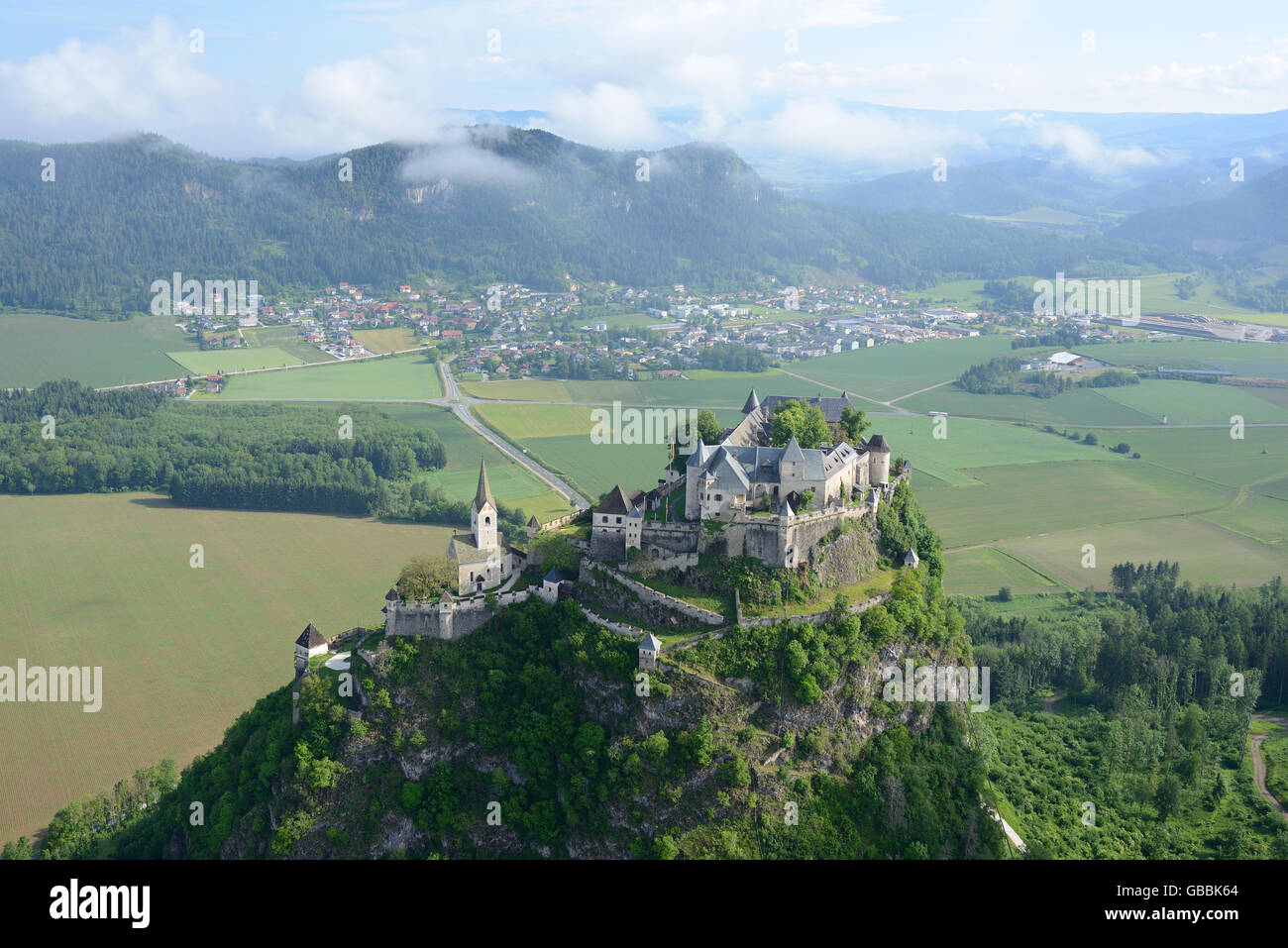 AERIAL VIEW. Medieval castle built on an impregnable lofty rock. Hochosterwitz Castle, Carinthia, Austria. Stock Photo