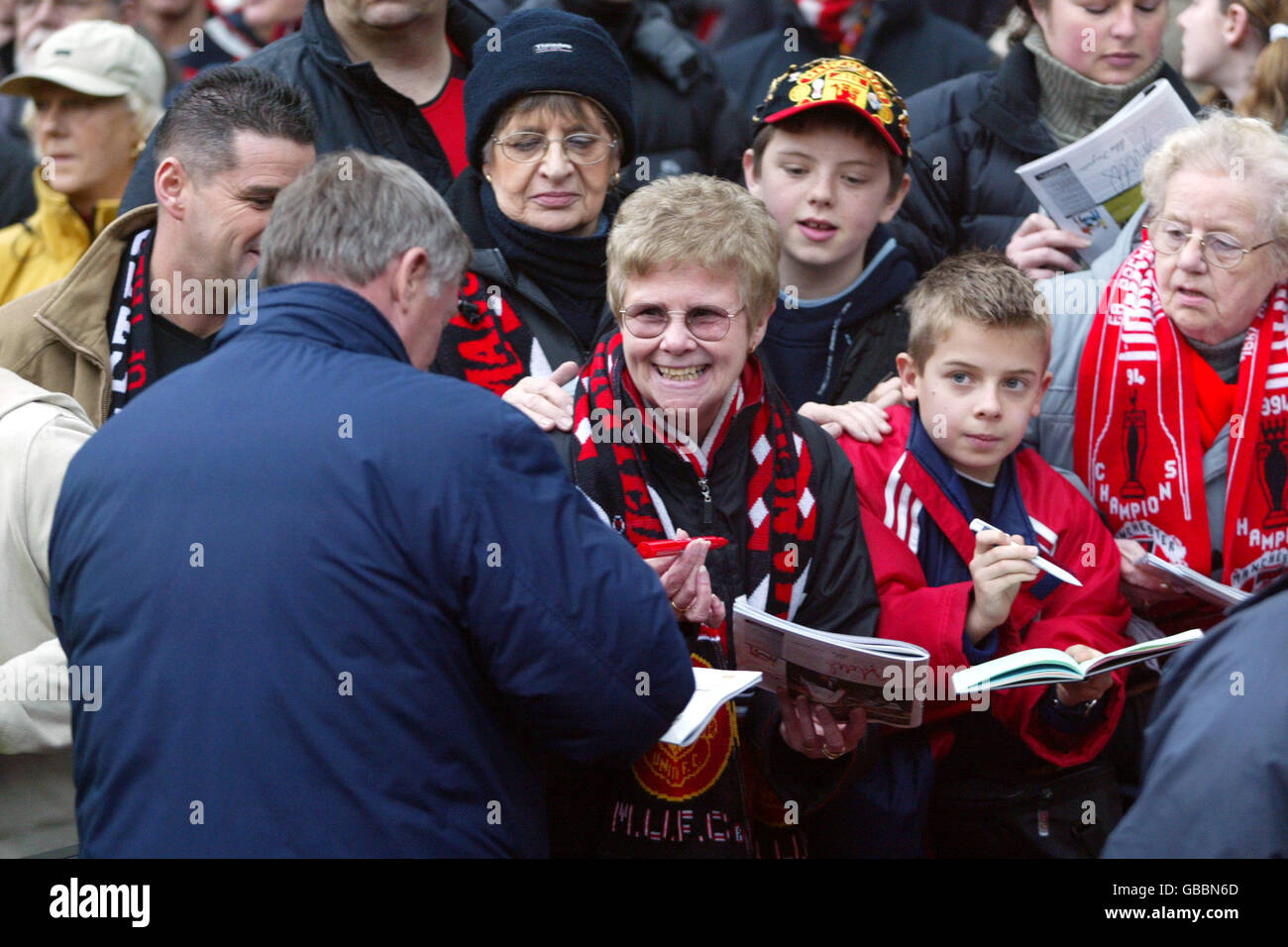 Manchester United manager Alex Ferguson signs autographs for his loyal fans Stock Photo