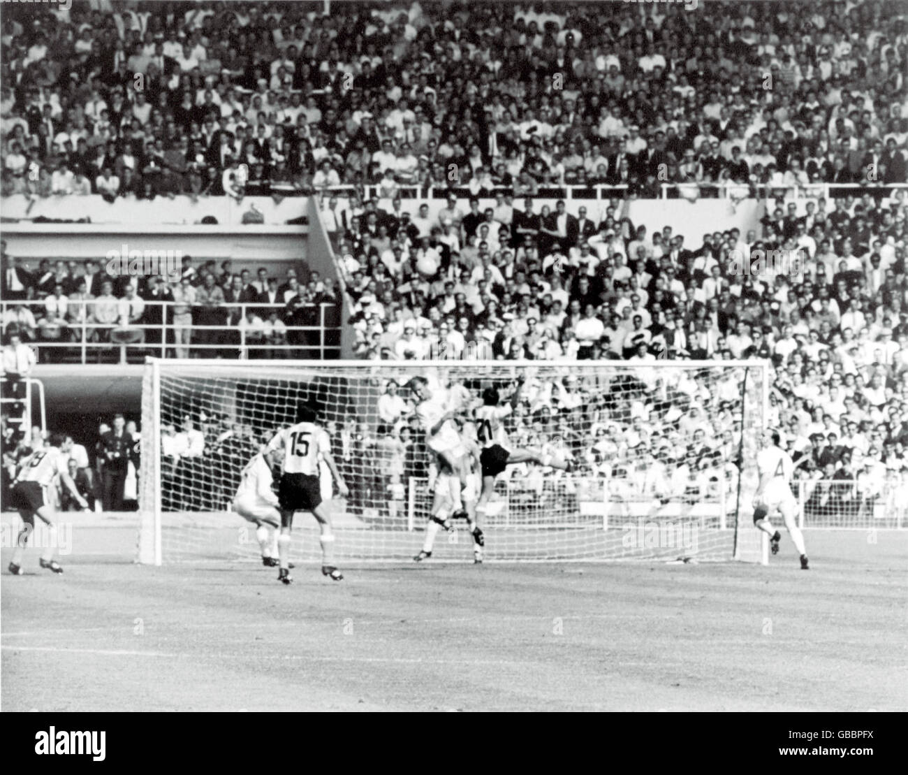 England's Jack Charlton (fourth l) and Argentina's Oscar Mas (second r) challenge for a header in the England goalmouth, watched by England's Nobby Stiles (r), George Cohen (second l) and Gordon Banks (c, hidden), and Argentina's Luis Artime (l) and Jorge Solari (third l) Stock Photo