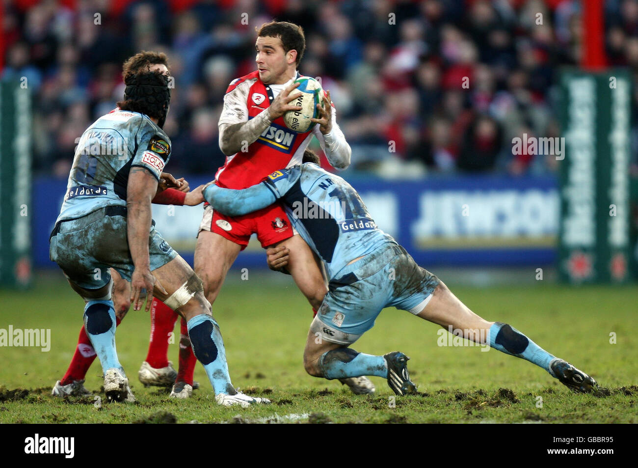 Gloucester's Olly Barkley is tackled by Cardiff's Nicky Robinson during the Heineken Cup match at Kingsholm Stadium, Gloucester. Stock Photo